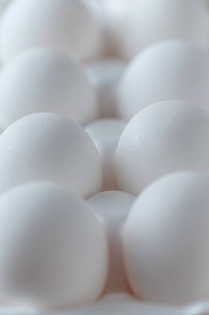 istock White raw chicken eggs in a plastic tray close-up. Chicken eggs background. 1226151045