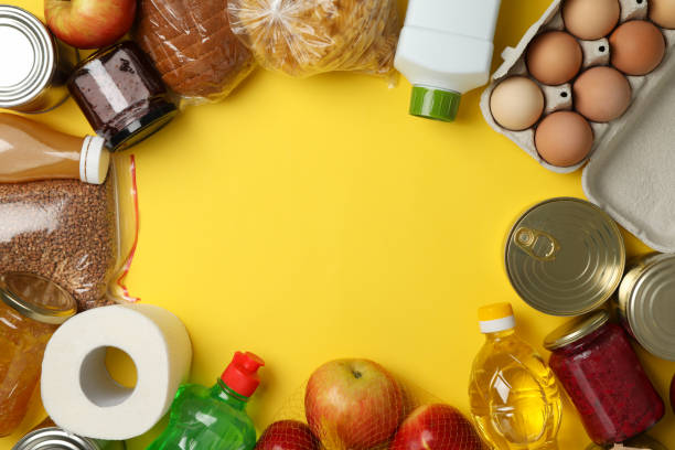 istock Different food on yellow background, top view. Donation concept 1226151112