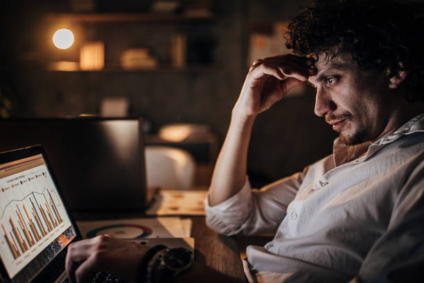 istock Businessman working late at night in office alone 1226151338