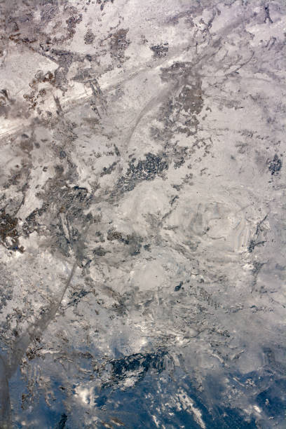 istock The structure of melted Baikal ice. Ice texture background with bubbles and thaw. Amazing winter pattern. Vertical. 1226155275