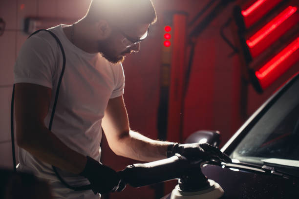 istock Car polish wax. worker hands holding a polisher 1226155862