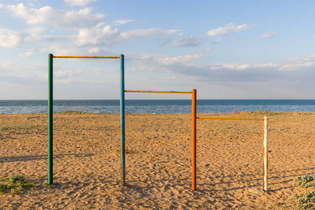 istock Large multi-colored turnstiles stand on the beach with clean blue sky. 1226162717