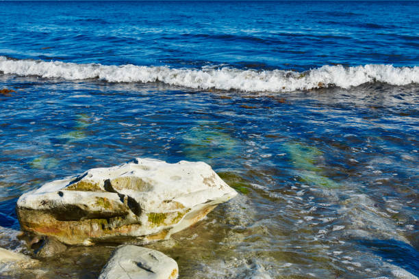 istock stones in the sea with waves 1226162944