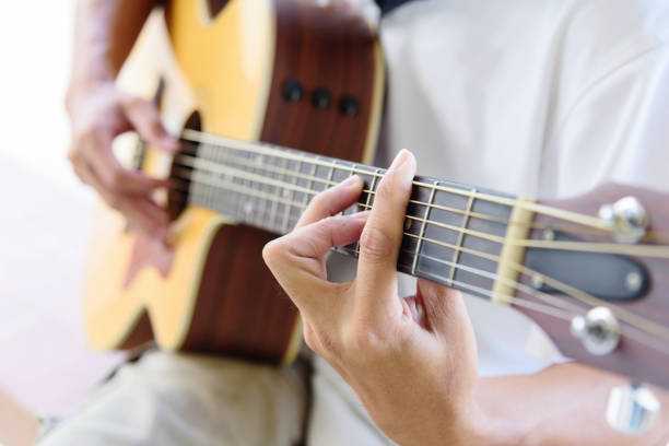 istock The man playing guitar in the park 1226163928