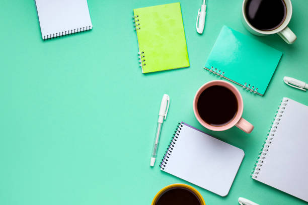 istock mint green background copy space with work accessories such as notebook, pens, coffee 1226164702