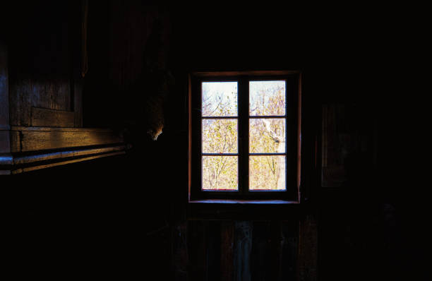 istock Dark room with sunlit windows as an abstract background. 1226166263