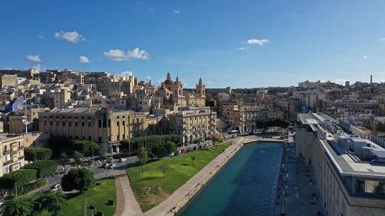 Aerial view of Bormla old town, Malta. Ancient historic architecture: St. Lawrence's Church in Birgu. View from grand bay.  Summer sunny day.