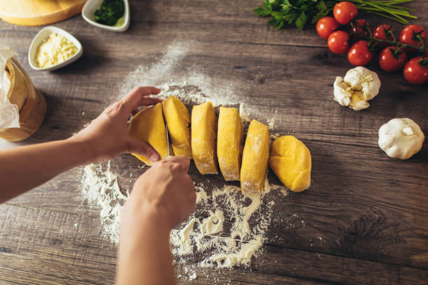 istock Cut the dough for the homemade pasta. 1226173294