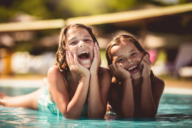 Ready for summer. Ready for summer. Children in pool. girls laying on beach stock pictures, royalty-free photos & images