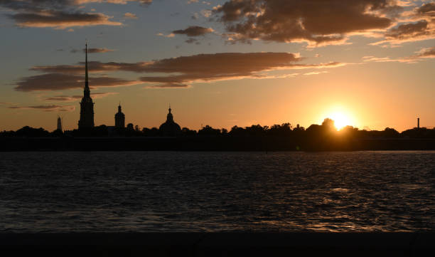istock old city tower behind river in beautiful sunset 1226173799