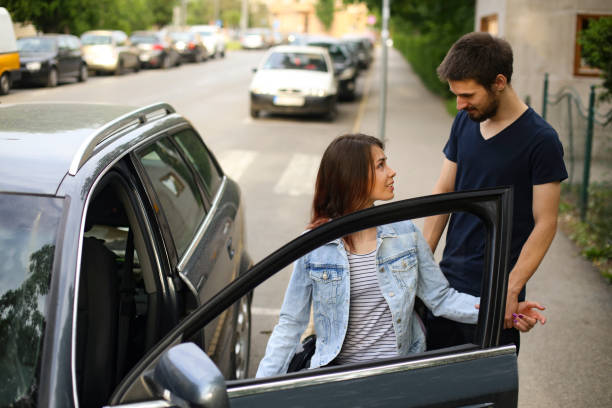 istock Handicapped young woman getting in a car 1226175226