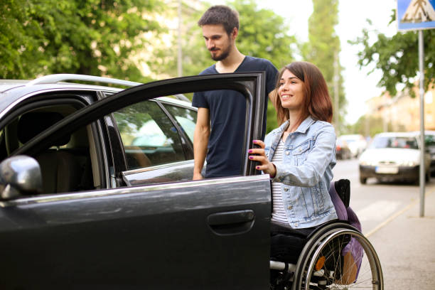 istock Disabled young woman getting in a car 1226175227