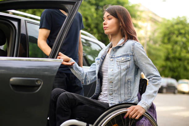 istock Disabled young woman getting in a car 1226175234