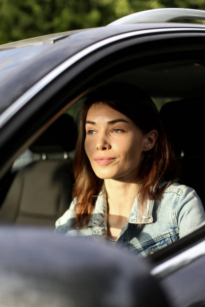 istock Young woman driving a car 1226175291