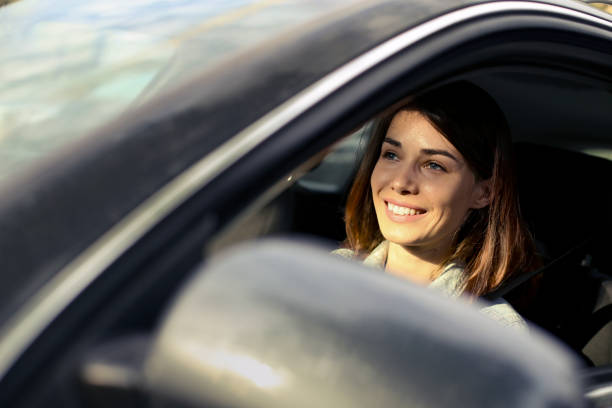 istock Young woman driving a car 1226175298