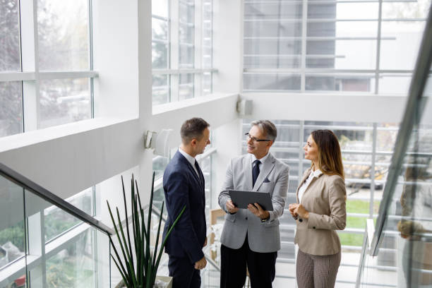 istock Business people collaborating over digital tablet on the staircase 1226176548
