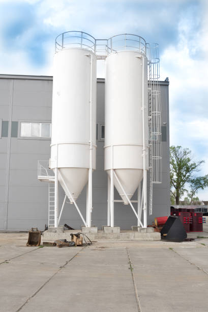 istock Silo for storage. Remote storage. Agricultural industry. Blue sky, white clouds. 1226176783