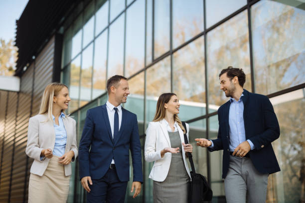 istock Four young executives talking on the street 1226176832