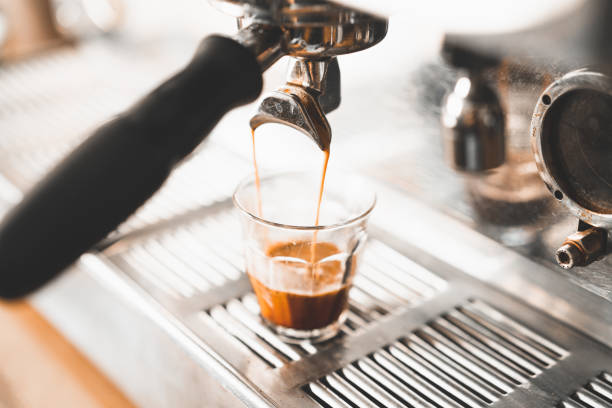 istock Fresh espresso pouring down into a glass 1226181730
