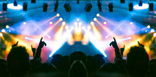 istock Concert hall with people silhouettes 1226181927