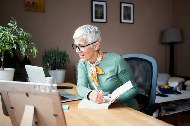 istock Mature woman working indoors at home office 1226184314