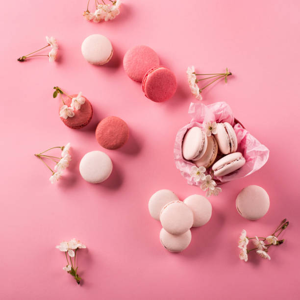 istock Roze macaroons in gift box and Cherry blossoms 1226187282