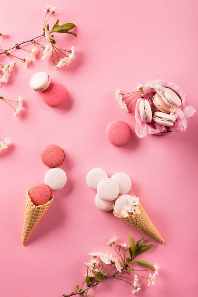 istock Roze macaroons in gift box and Cherry blossoms 1226187310