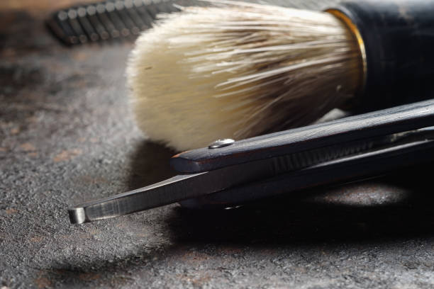 istock On a rusty surface are old hairdresser tools. razor, shaving brush, comb. close up. rustic. horizontal. copy space. 1226188157