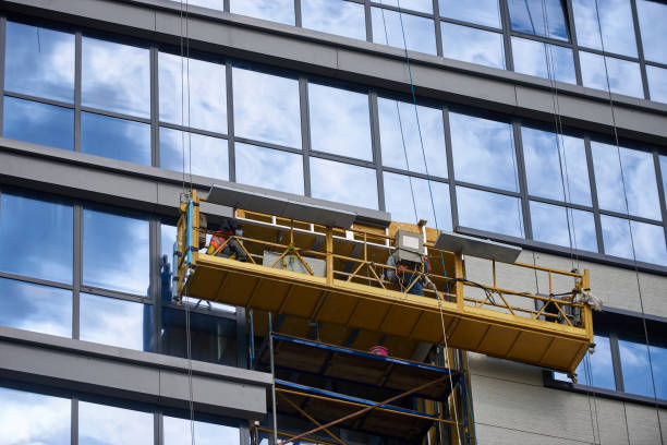 istock Scaffold elevator insulated wall facade with mineral wool. Modern office or residential building under construction. 1226188215