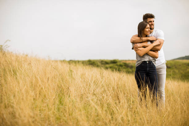 istock Young couple in love outside in spring nature 1226189670