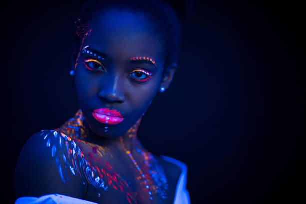 istock young woman with colorful abstract make-up 1226190546