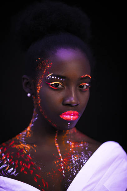 istock african model in neon light, girl with fluorescent makeup 1226190739