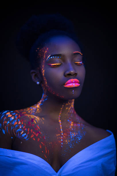 istock african model in neon light, girl with fluorescent makeup 1226190805