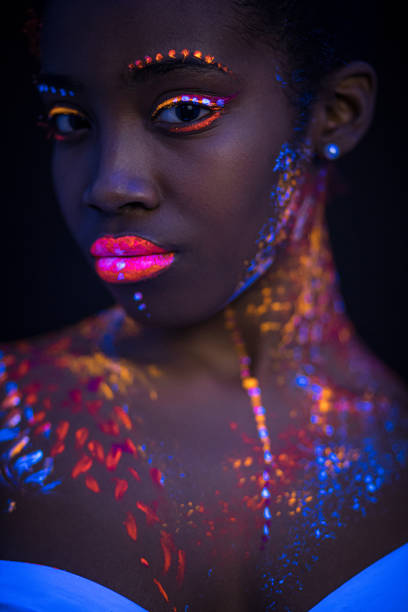 istock young woman with colorful abstract make-up 1226191061