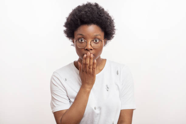 istock black surprised woman blowing the gaff 1226191105