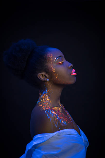 istock young female painted with UV makeup color 1226191141