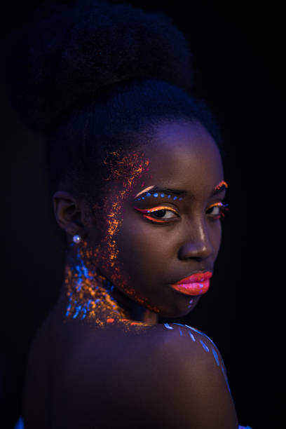 istock fluorescent makeup on woman's skin glowing under ultraviolet light 1226191246