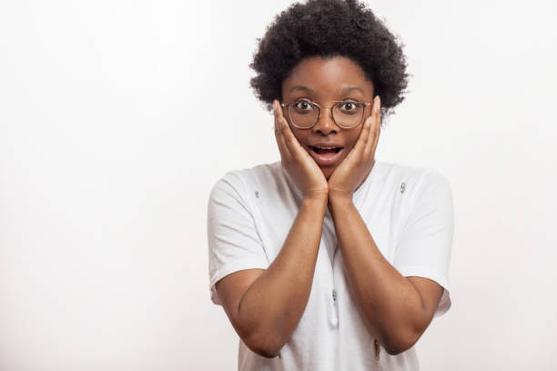 istock surprised awesome woman holding cheeks by hand . 1226191342