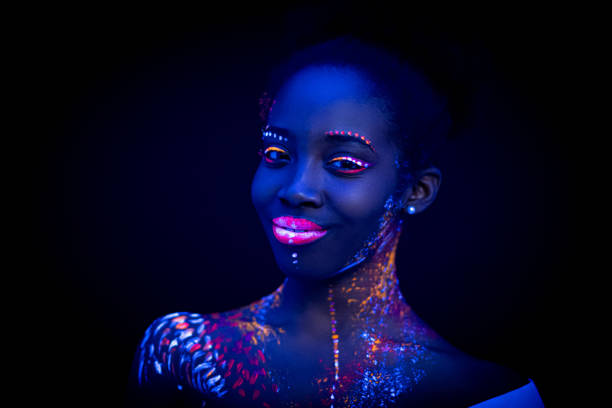 istock young female painted with UV makeup color 1226191395