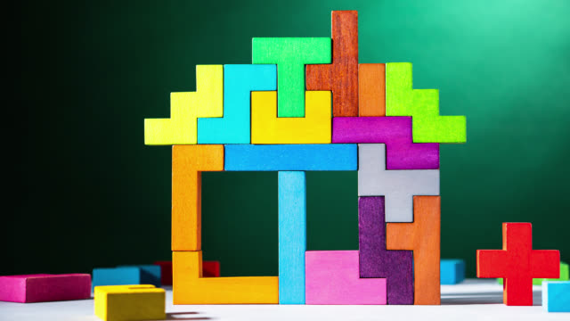 House is building with colourful wooden blocks, stop motion, animation. The concept of logical thinking.