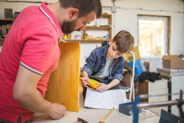 istock Father and Son Making a Birdhouse 1226192206
