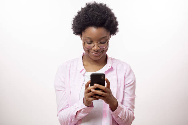 istock cheerful awesom afro woman using her smart phone 1226192214
