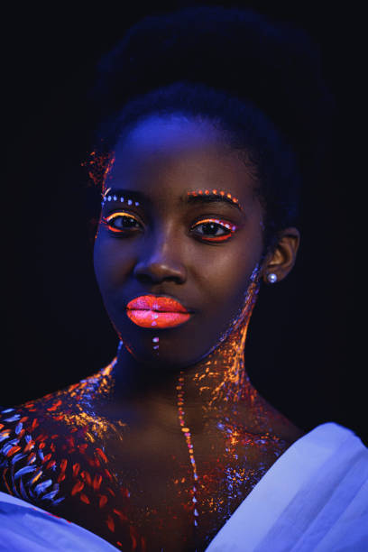 istock beautiful girl with creative fluorescent prints on skin 1226192409