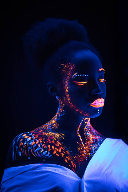 istock young female painted with UV makeup color 1226192537