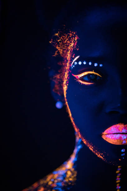 istock beautiful girl with creative fluorescent prints on skin 1226192917