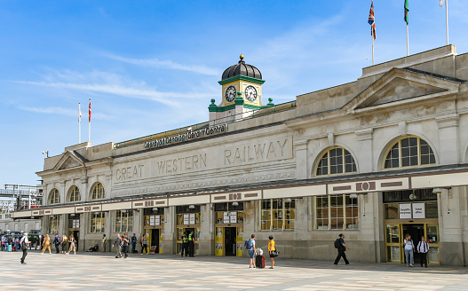 Cardiff, Wales - July 2019: Exterior view of the front of Cardiff Central railway station in the city centre. The area outside the entrance has been pedestrianized,