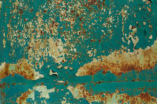 Close up coplosition of the corroded and peeled painted wall