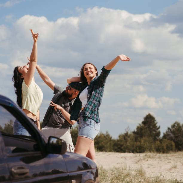 istock Three friends enjoying vacation travel by car 1226194239