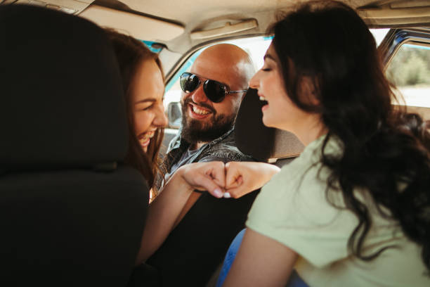 istock Three friends enjoying vacation travel by car 1226194332