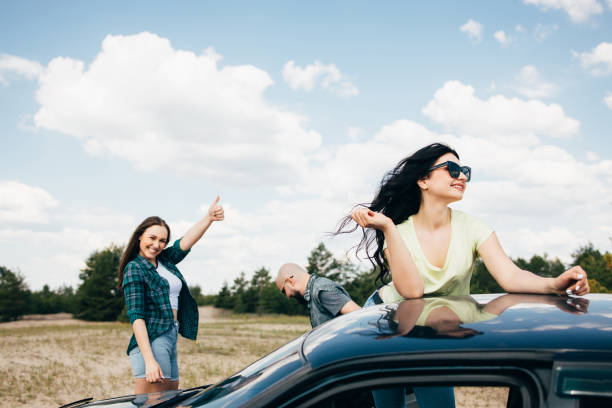 istock Three friends enjoying vacation travel by car 1226194356